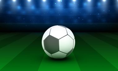 Parlak futbol stadyumu yer, gece görünümü.