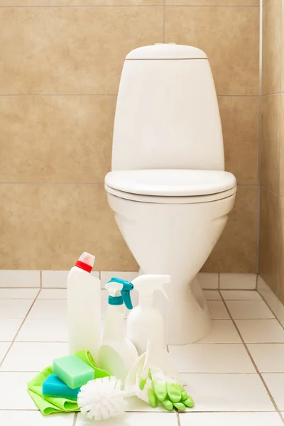 Cleaning items gloves brush white toilet bowl bathroom — Stock Photo, Image
