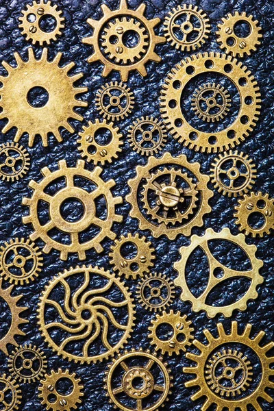 steampunk mechanical cogs gears wheels on leather background