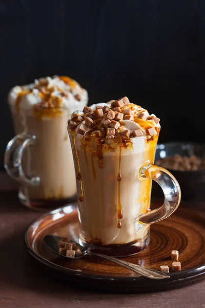 Cafe latte with whipped cream and caramel — Stock Photo, Image