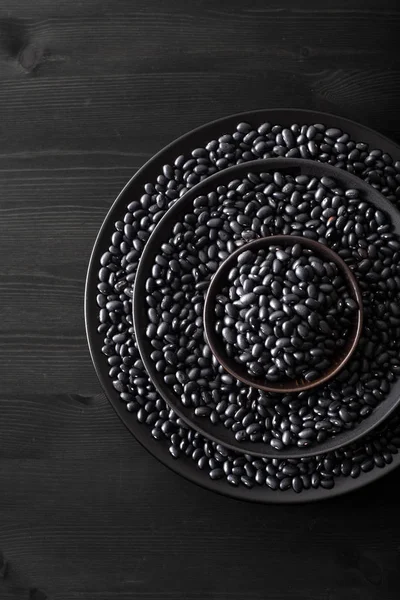 Black turtle beans legumes in bowls — Stock Photo, Image