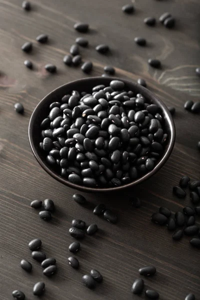 Black turtle beans legumes in bowl — Stock Photo, Image