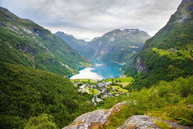 view on Geiranger village from Flydalsjuvet viewpoint, Norway clipart