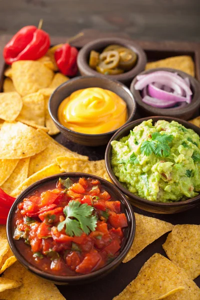 Mexican nachos with guacamole, salsa and cheese dip — Stock Photo, Image