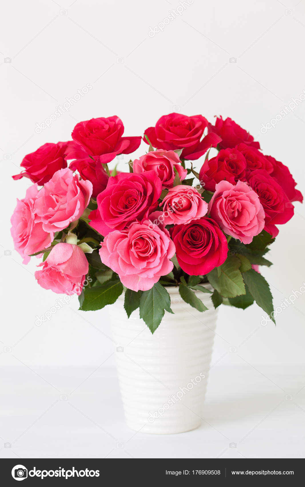 Beautiful red rose flowers bouquet in vase over white Stock Photo ...