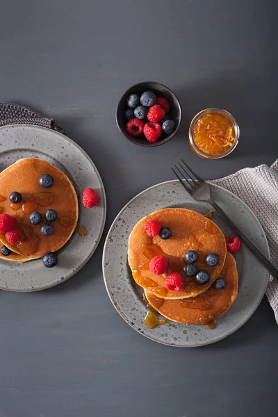 Pancakes with blueberry raspberry honey and jam for breakfast — Stock Photo, Image