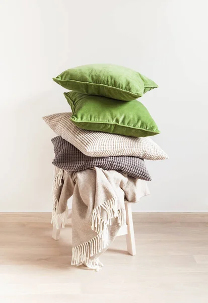 Gray and green cushions, throw. cozy home — Stock Photo, Image