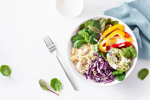 veggie couscous lunch bowl with avocado, bell peppers, spinach a