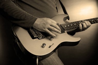 musician rock guitarist playing a guitar