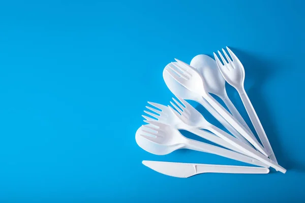 single use plastic forks, spoons. concept of recycling plastic, plastic waste