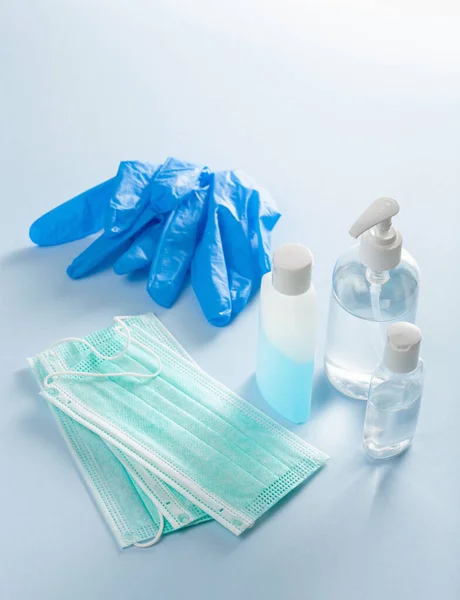 protective medical mask, sanitizer gel and gloves. protective measures against virus, bacteria