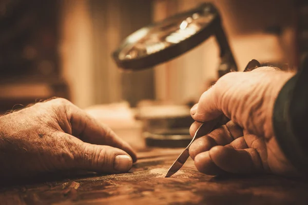 Senior restorer working with antique decor element — Stock Photo, Image