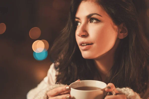 Portrait of beautiful young woman with cup of tea — Stock Photo, Image