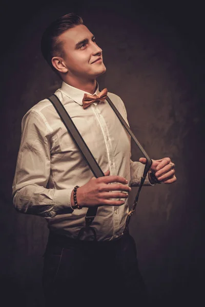 Sharp dressed man wearing suspenders and bow tie — Stock Photo, Image