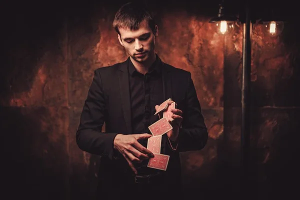 Man showing tricks with cards — Stock Photo, Image