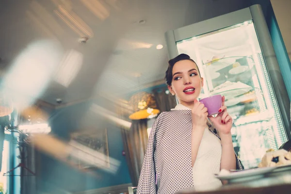 Elegant young lady alone in a cafe — Stock Photo, Image