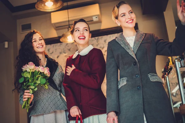 Three elegant young ladies ready for a party — Stock Photo, Image