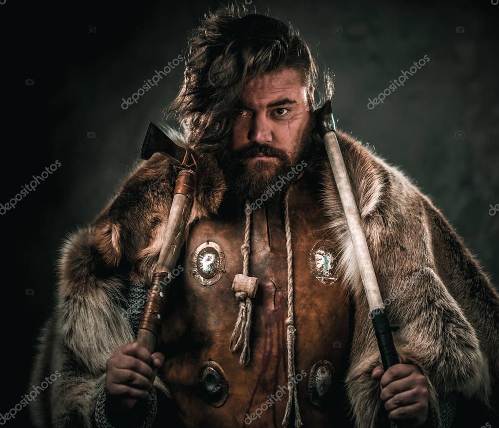Viking with cold weapon in a traditional warrior clothes — Stock Photo
