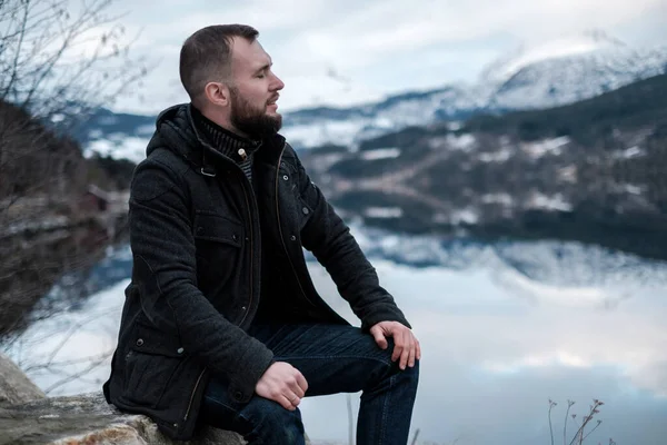 Man sitting near Hardangerfjord, Norway. — Stock Photo, Image