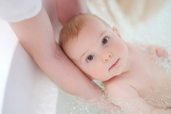 Baby boy getting an aquatic massage — Stock Photo, Image