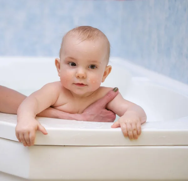 Baby boy getting an aquatic massage Royalty Free Stock Images