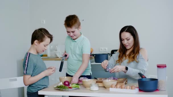 Happy family cooking togehter at home — Stock Video