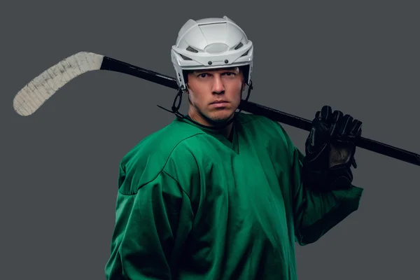 Hockey player holds gaming stick — Stock Photo, Image