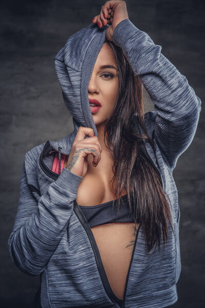 Sensual female in grey hoodie