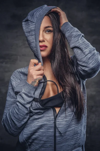 Sensual female in grey hoodie