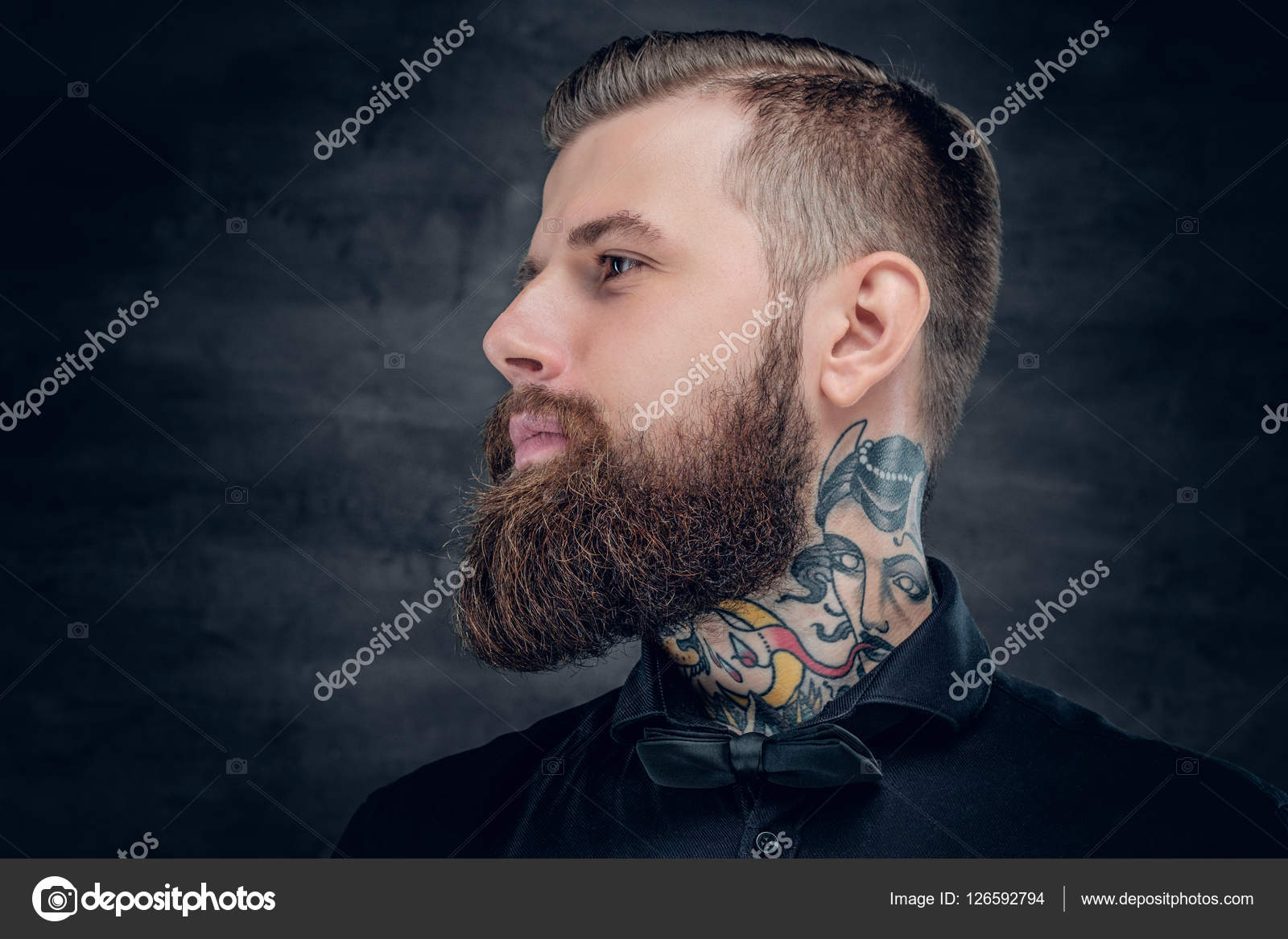 Bearded hipster male with tattoo on his neck. Stock Photo by ©fxquadro  126592794