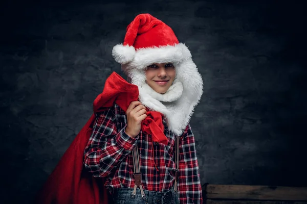 Boy holds New Year gift sack — ストック写真