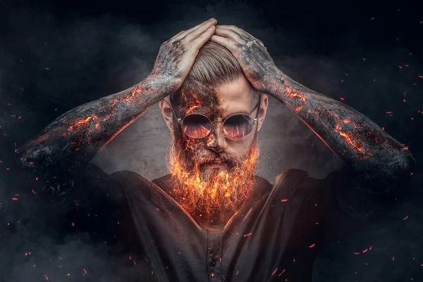 Demonic male with burning beard — Stock Photo, Image