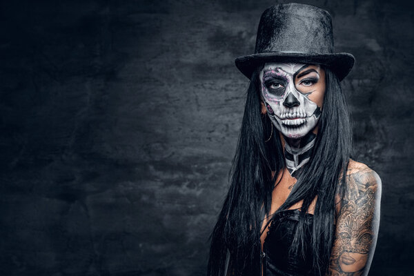 Girl with skull make up in top hat