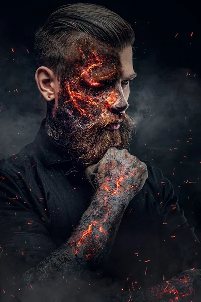 Creepy demonic male in a fire sparks — Stock Photo, Image