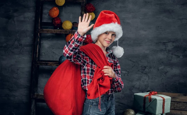 Boy holds New Year gift sack — Stock Photo, Image