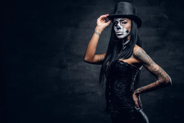 Girl in stylish top hat with skull make up. — Stock fotografie