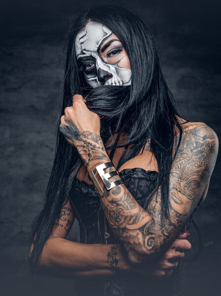 Tattooed girl with skull make up