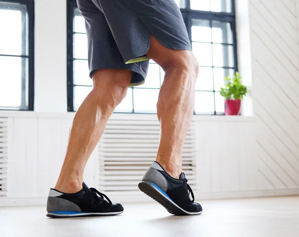 Man's legs in fitness shoes — Stock Photo, Image