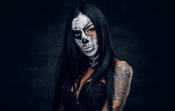 Tattooed girl with skull make up