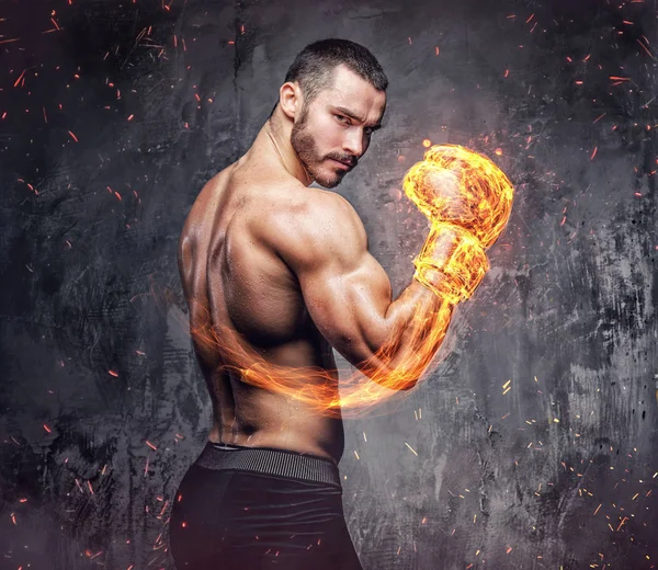 Shirtless fighter with burning boxer glove. — Stock Photo, Image