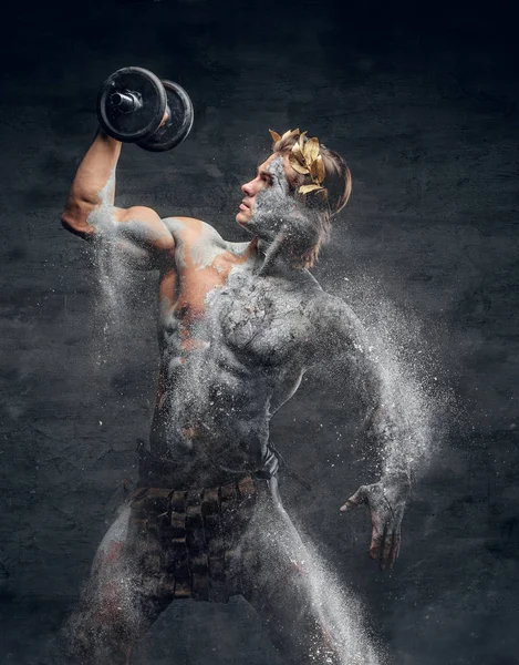 Ancient Greek sportsman holding dumbbell. — Stock Photo, Image