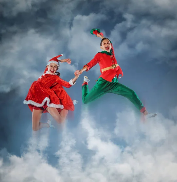 Funny kids in Peter pan and snow maiden costumes — Stock Photo, Image