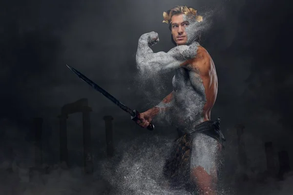 Stone warrior holds a sword — Stock Photo, Image