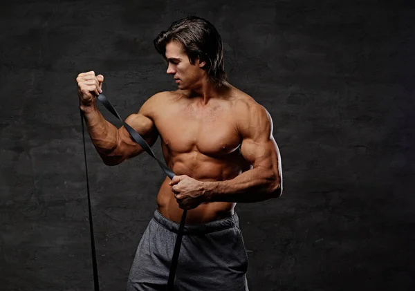 Athletic man with fitness trx straps — Stock Photo, Image