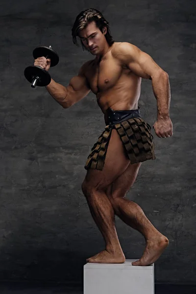 Athletic shirtless male posing on podium — Stock Photo, Image