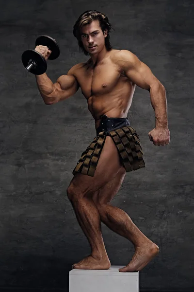 Athletic shirtless male posing on podium — Stock Photo, Image