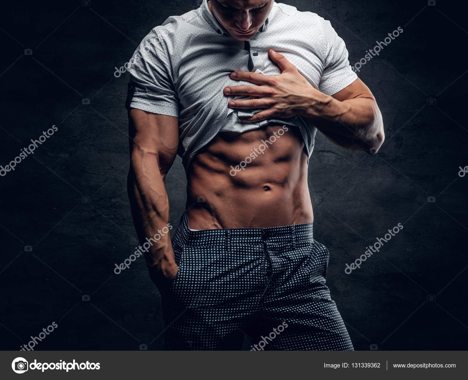 Athletic man showing six pack Stock Photo by ©fxquadro 131339362