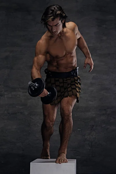 Athletic shirtless male posing on podium — Stock Photo, Image