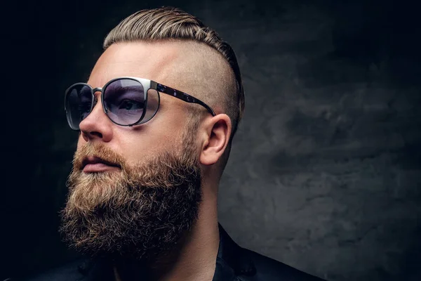 Bearded man in purple sunglasses