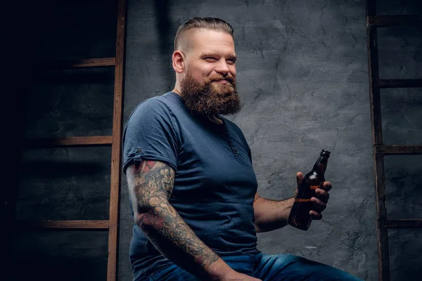 Bearded man enjoys of a beer — Stock Photo, Image